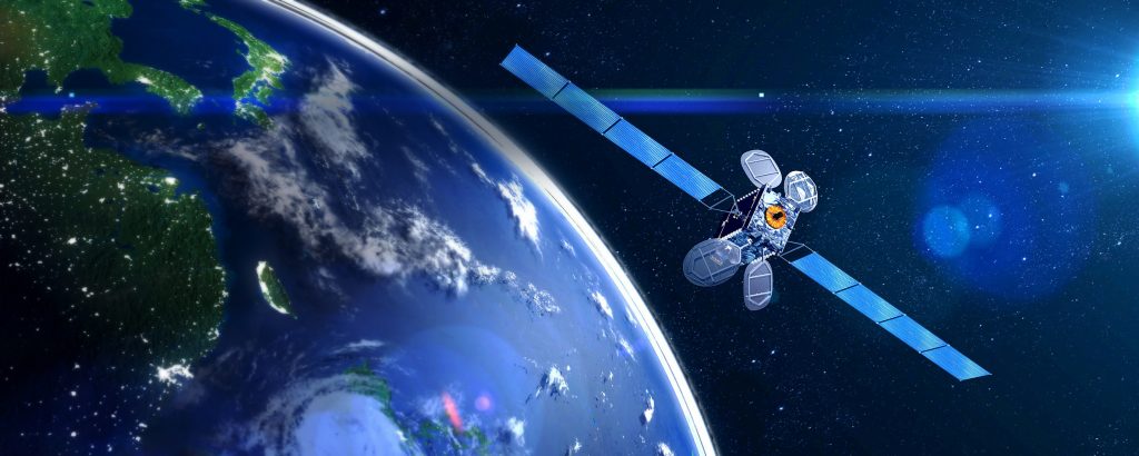 Ilustrasi satelit mengorbit di atas bumi.